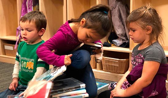 Kids looking at books