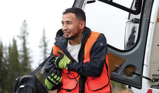 AEI Bear Guard and Ahtna shareholder Christopher Hobson unloading the helo.