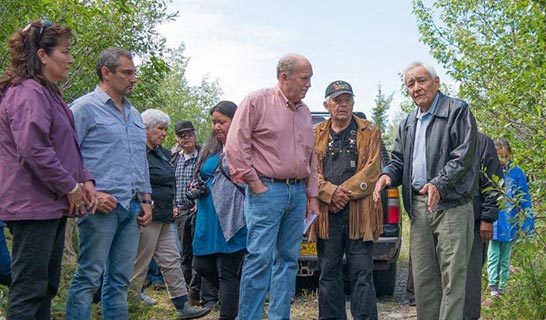 Group of people gathered at Gulkana Lands engaged in conversation