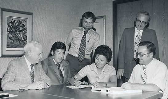 Black and white photo of Ahtna group signing of Land Claims