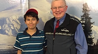 Alyeska Pipeline Service Co. President Admiral Barrett with Ahtna shareholder Wanda Bell’s son Anthony Nelson.