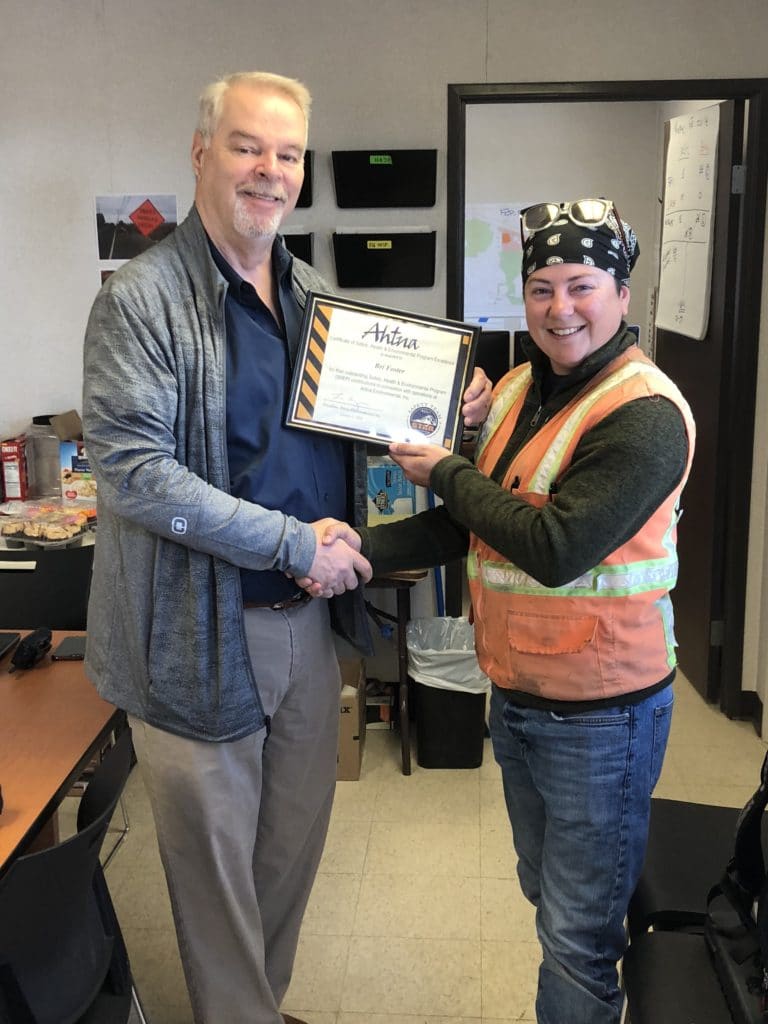 Bri (Christina) Foster is presented her safety award by Chuck Holman, AEI Vice President at Marine Ocean Terminal Concord (MOTCO).