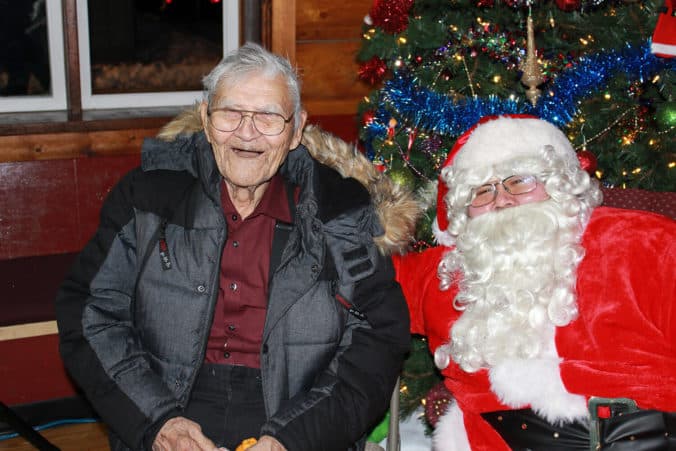 Chief Ewan visiting with Santa at the Glennallen Christmas Gathering