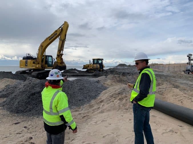 Craig O’Rourke , AMCC President (on the right), and employee Keith Korbin at the Westerly Beach