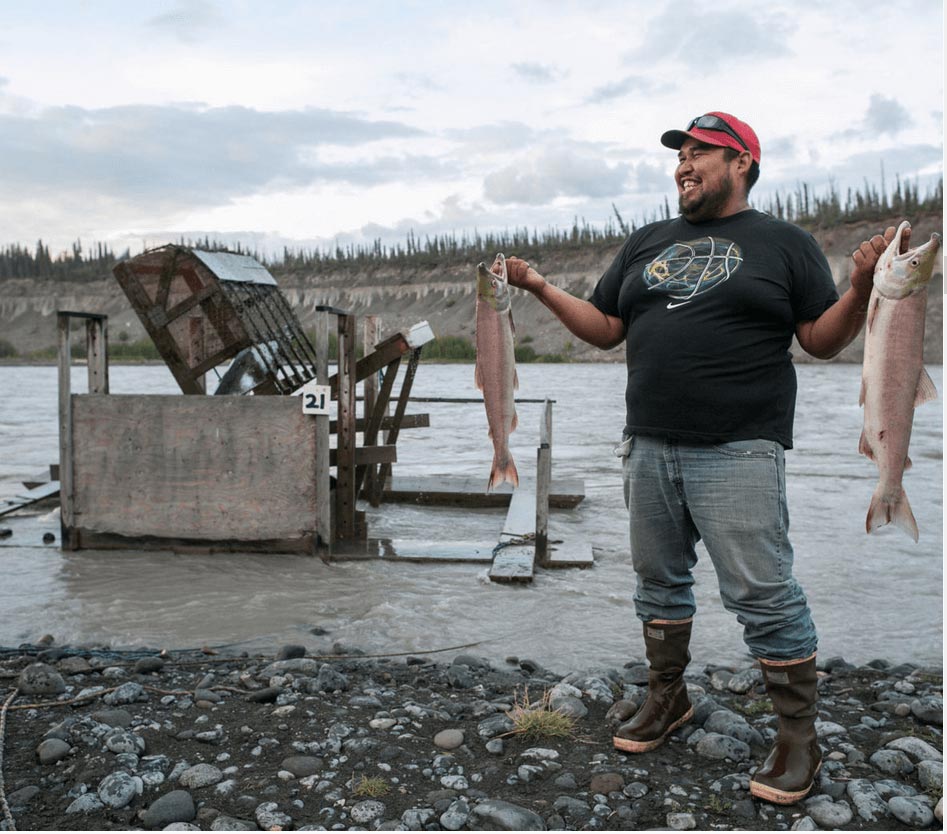 Eric Stevens uses a fish wheel to catch salmon.