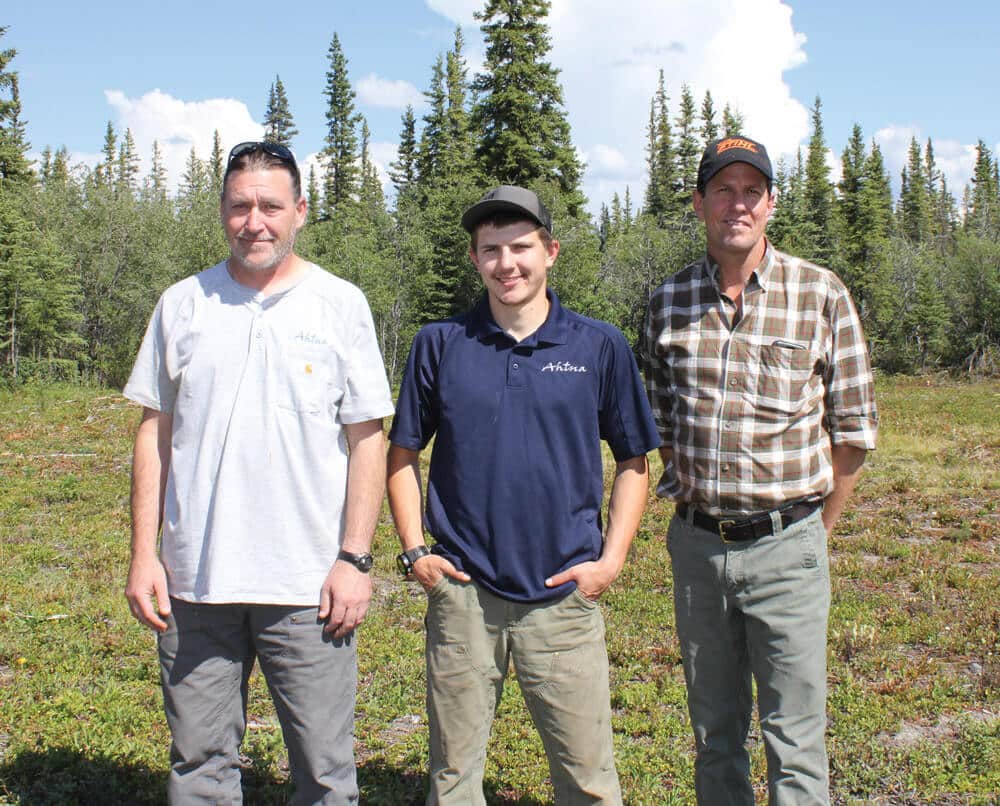 Outdoor photo of three technicians