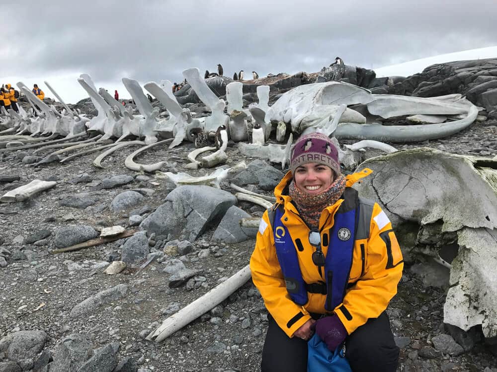 Outdoor photo of Jamie Ginn in front of whale skeleton