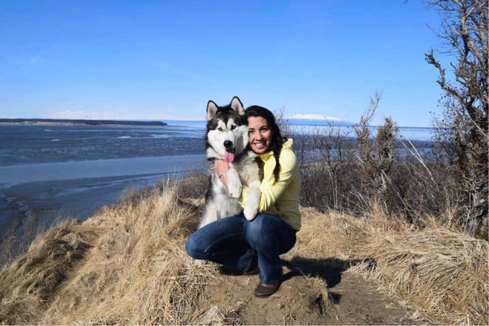 Photo of Karla Broillier and her dog outdoors