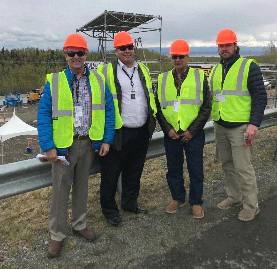Photo of 4 Ahtna Engineerings in the field, looking at the camera