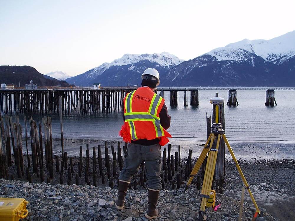 Ahtna engineer at work with view of the ocean and the mountains