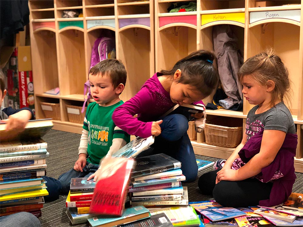 Kids looking at books