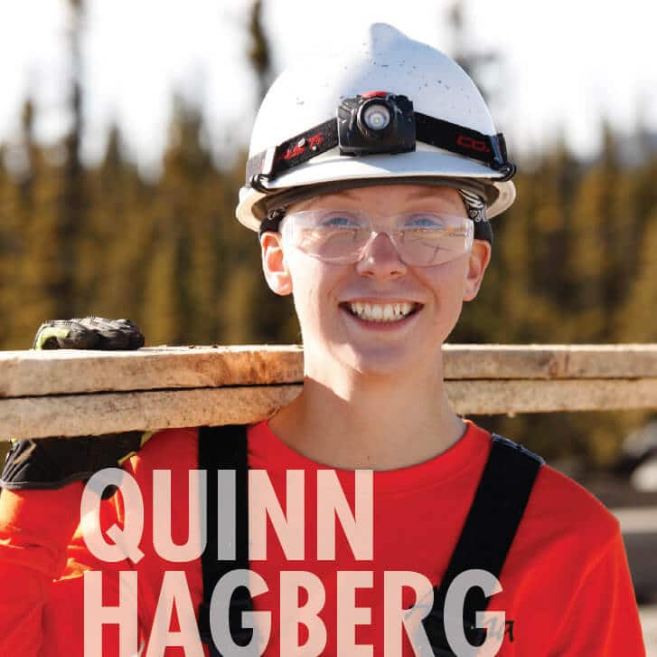 Quinn Hagberg in work uniform, smiling at camera