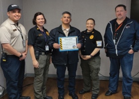 Ricardo Bustamante being presented with a Level 1 STAR  Award.